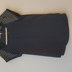 Black silky top with gold metal circles, cap sleeve